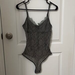 MISSGUIDED SHEER LACE BODYSUIT.